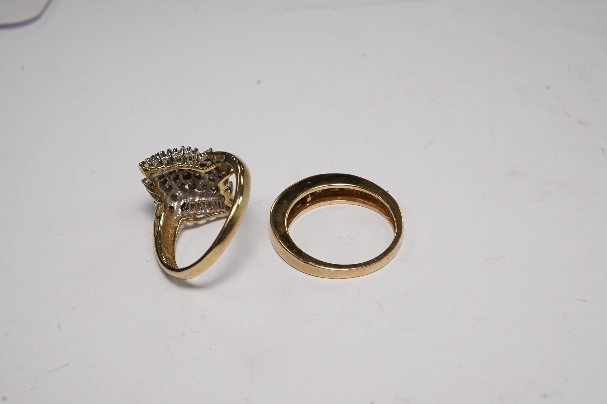 Two modern 9ct gold and diamond set rings, diamond chip cluster and five stone coloured diamond set half hoop, both size L, gross weight 6.4 grams. Condition - poor to fair